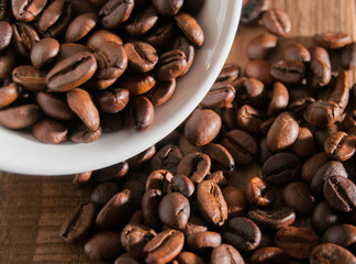 Close-up of half a cup of coffee beans