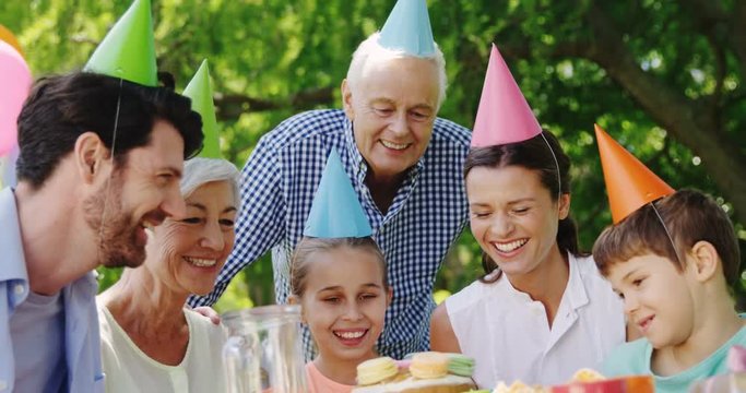 Multi-generation family celebrating birthday party