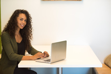 Happy Woman Working on Laptop