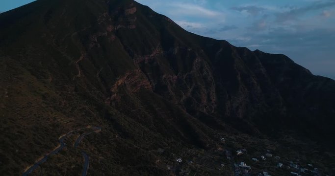 panning aerial view of mediterranean sea Salina volcano mountain and Pollara town.Nature outdoors travel establisher,Italy,Sicily Eolian Island.Summer or spring.4k drone establishing video