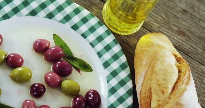 Pickled olives, oil and bread 