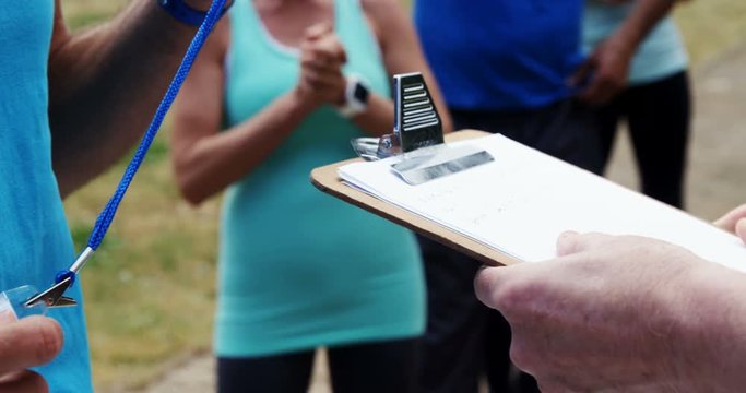 Volunteer registering athletes name for race
