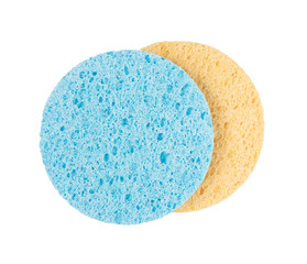 Blue and yellow two piece sponge circle shape cleansing puff for face or cleaning isolated on white background object