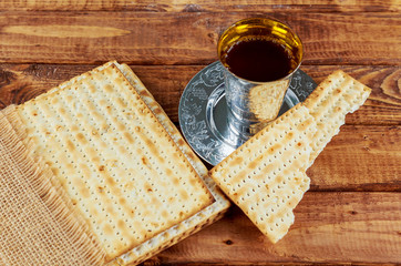 Red wine, cup full of wine with the text of the traditional wine blessing