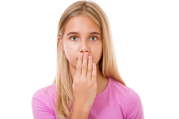 Picture of lovely young girl  with hand over mouth.Isolated