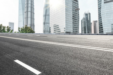 empty asphalt road and modern buildings in shanghai,china.