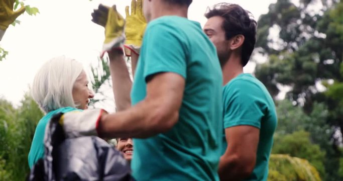 Family giving high five to each other - Powered by Adobe