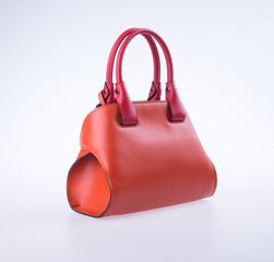 bag or brown leather woman handbag on background.
