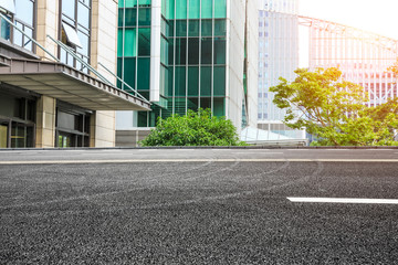 empty asphalt road and modern buildings in shanghai,china.