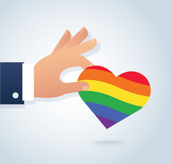 hand holding rainbow flag heart vector. Love is love, love wins.  