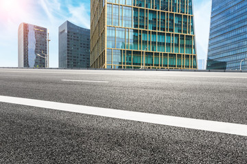 Fototapeta na wymiar empty asphalt road and modern buildings in shanghai,china.
