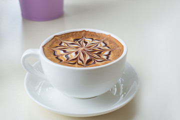 latte art coffee or cappuccino isolate on white table background