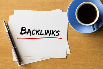 Backlinks - handwriting on papers with cup of coffee and pen, business concept