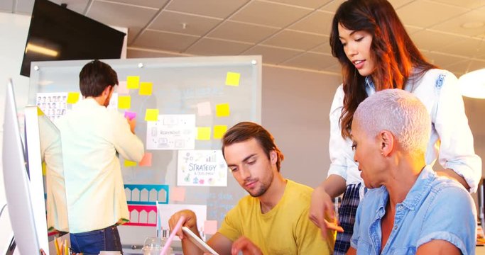 Creative business team working together at desk
