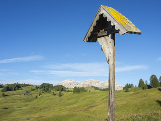 Wooden crucifix that can be found along the Dolomites trails