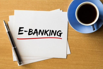 E-banking - handwriting on papers with cup of coffee and pen, business concept  