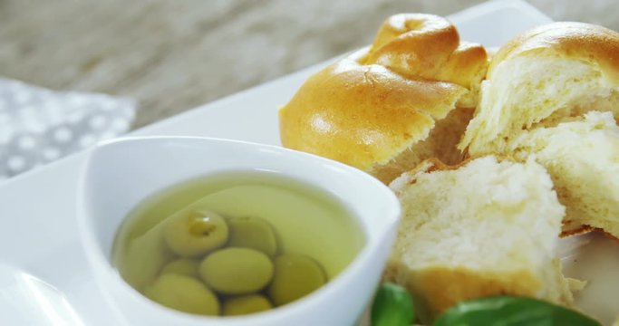 Pickled olives, herb and pieces of bread