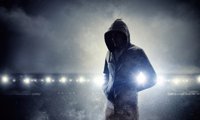Silhouette of man in hoody