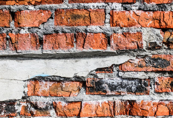 Текстура кирпичной сломанной стены из оранжевого материала