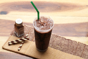Ice cocoa soft drink on wood floor and topping