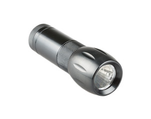 Metal flashlight over white background