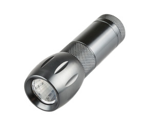 Metal flashlight over white background