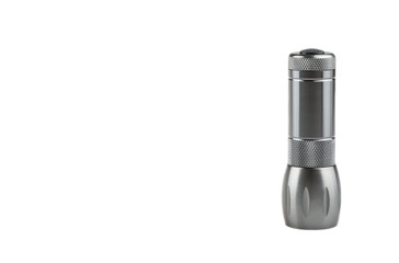 Metal flashlight over white background