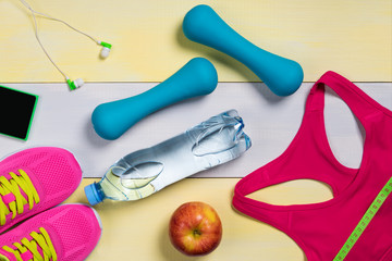 Beautiful sport set with apple on a background of yellow and gray