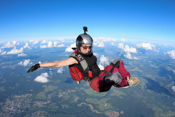 Girl skydiver is in the sky