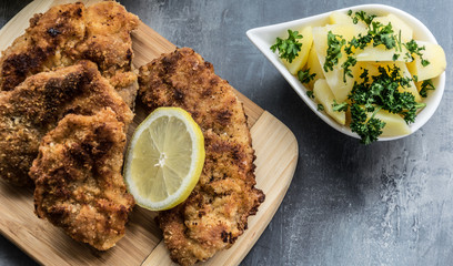 Pork steak fried on lard with parsley potatoes and pastry