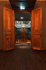 Obraz na płótnie Canvas vintage high doors in the mansion converted into a nightclub. loft style