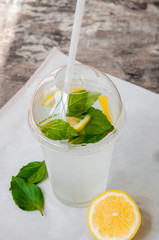 Drink: water with lemon and basil leaves