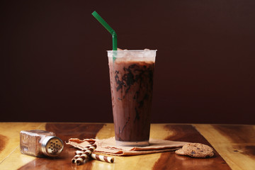 Ice cocoa soft drink on wood floor and topping