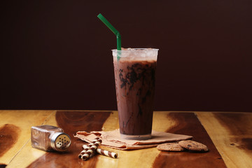 Ice cocoa soft drink on wood floor and topping
