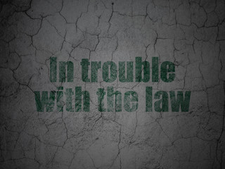 Law concept: In trouble With The law on grunge wall background