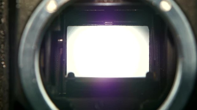 Closeup camera lens. Camera shutter aperture transition in slow motion