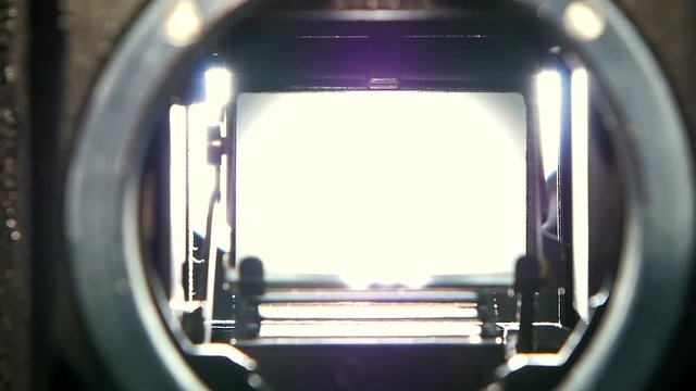 Closeup shot of diaphragm camera shutter blade in slow motion