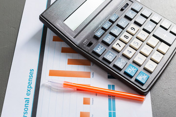 Checking accounting report on business table. Calculator