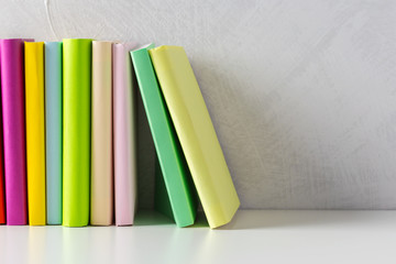  pile of paperback books on a table