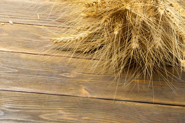 Wheat Ears on the Wooden Table