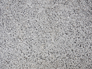 Close up of a porous concrete gray wall empty urban background