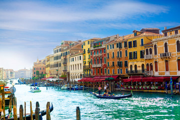 Amazing view on the beautiful Venice, Italy. Many gondolas sailing down one of the canals.