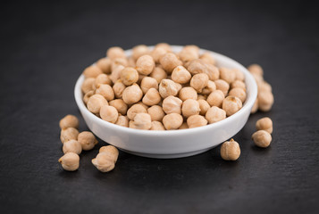 Chickpeas on a slate slab, selective focus
