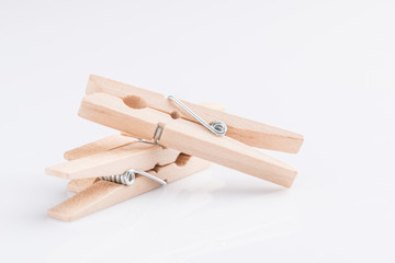 Wooden clothespin on white background