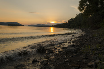 beauty sunset in summer by Danube river, Hungary