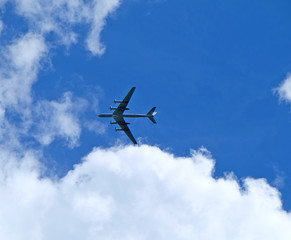 Fototapeta na wymiar silhouette of Russian strategic bombers Tu-95 on the background of cloudy sky