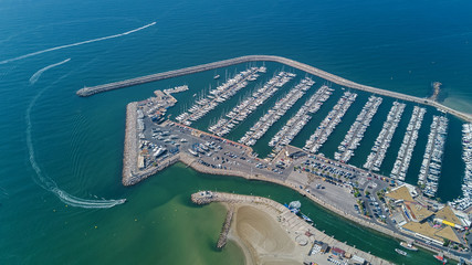 Aerial top view of boats and yachts in modern marina from above, Mediterranean sea, South France
