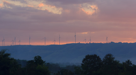 Electric turbine on the mountain at sunset