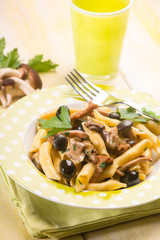 pasta with mushroom and black olives, selective focus