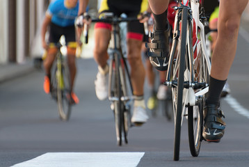 Fototapeta na wymiar Cycling competition,cyclist athletes riding a urban race